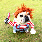 French bulldog on grass in striped shirt and overalls Halloween costume with red wig and foam knife